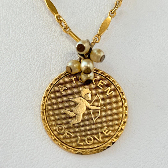 Gold Token of Love charm necklace. Cupid pendant necklace. Valentines gift for her.