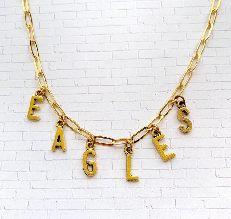 Philadelphia Eagles necklace. Gold paper clip chain necklace with letter charms that spell eagles.