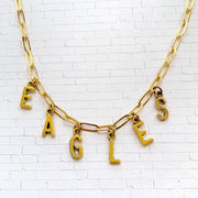 Philadelphia Eagles necklace. Gold paper clip chain necklace with letter charms that spell eagles.