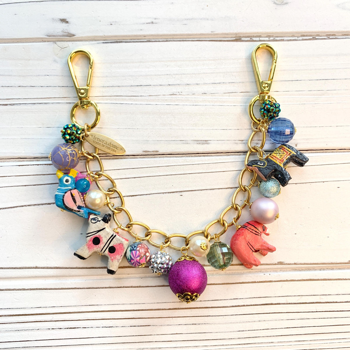 Gold bag chain with hand painted wood safari animals and a mix of colorful beads. Chain bag charm for handbags.