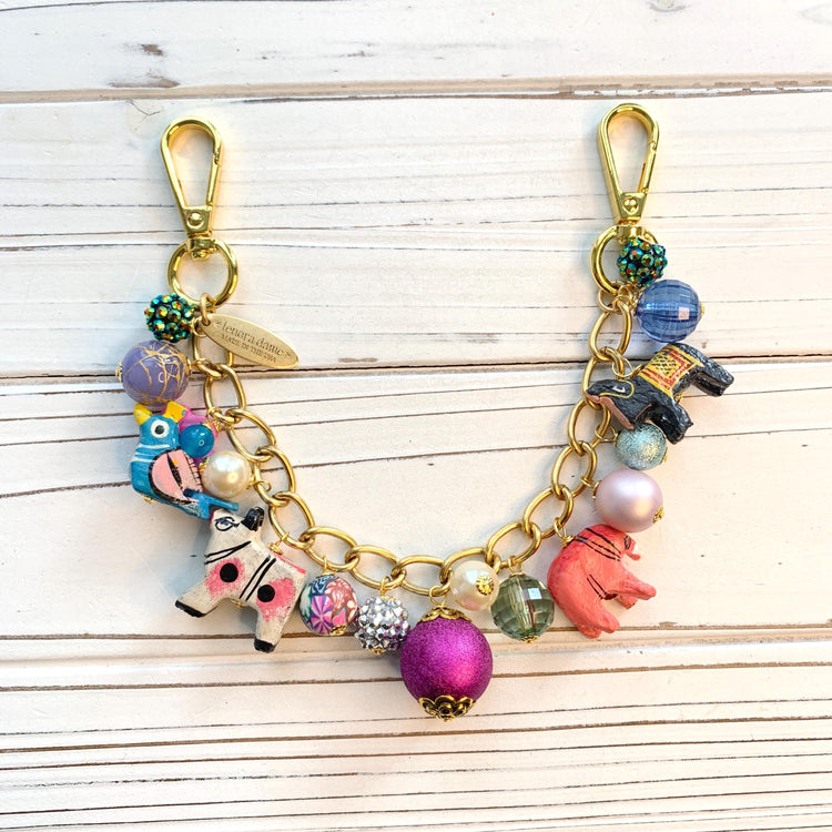 Gold bag chain with hand painted wood safari animals and a mix of colorful beads. Chain bag charm for handbags.