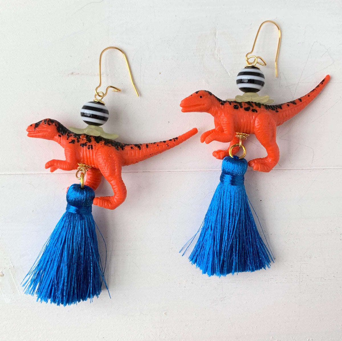 Dinosaur earrings for women. Lenora Dame dino earrings with tassels.